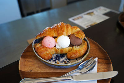 Close up croissant sandwich with ice cream