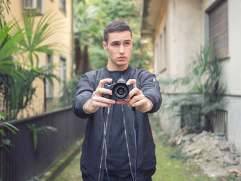 Portrait of man photographing