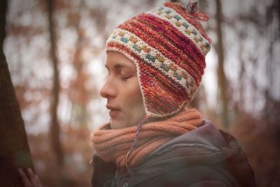 Close-up portrait of woman wearing hat