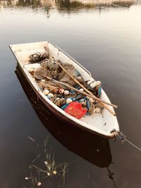 High angle view of fishing boat moored in lake