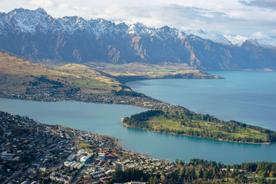 Scenic view of lake and mountains against sky