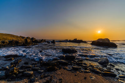 Scenic view of sea against sky during sunset