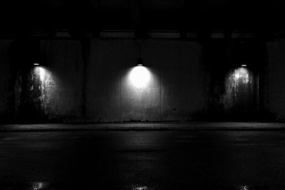 View of illuminated tunnel at night