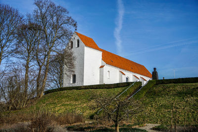 Low angle view of white church against sky