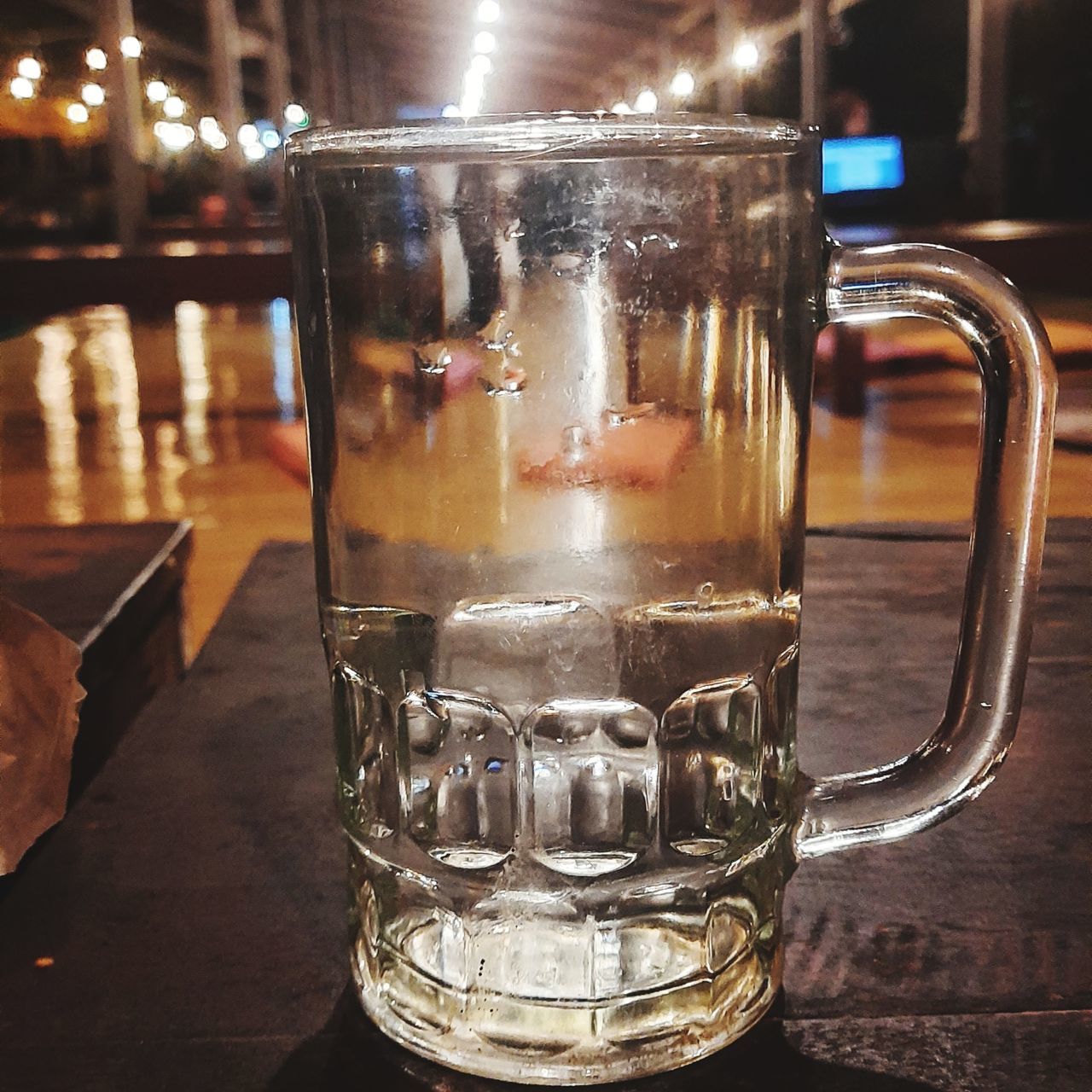 drink, food and drink, refreshment, table, glass, drinking glass, alcoholic beverage, household equipment, distilled beverage, indoors, still life, close-up, alcohol, freshness, beer glass, focus on foreground, no people, beer, pint, bar, lighting, mug, cup