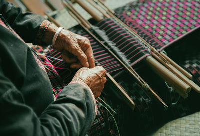 Midsection of woman working at workshop