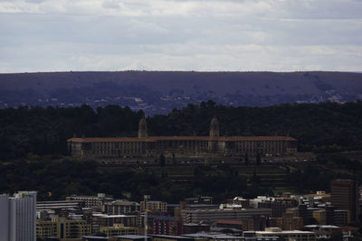 View of buildings in city against sky