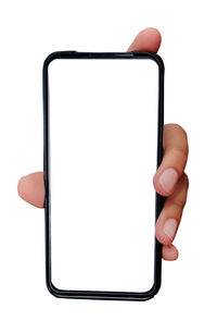 Close-up of hand holding smart phone against white background