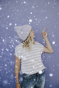 High angle view of woman standing on snow