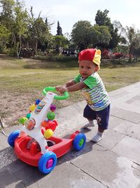 Cute boy playing with toy
