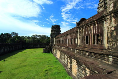 View of old building against cloudy sky