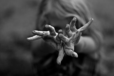 Close-up of girl showing messy hands