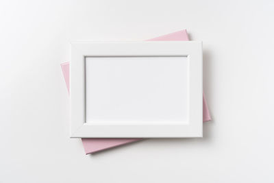 High angle view of paper on table against white background