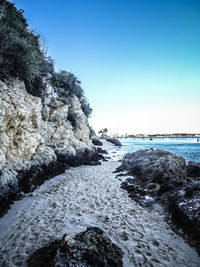 Scenic view of sea against clear blue sky