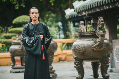 Portrait of woman standing in temple
