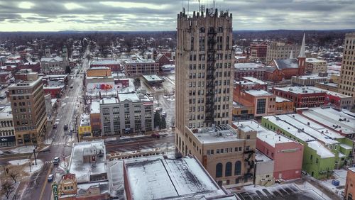 High angle view of buildings in city against sky