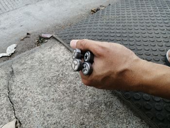 High angle view of man working on metal