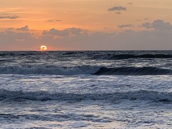 Scenic view of sea against sky during sunset