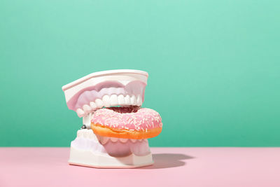 Close-up of cupcakes on table against gray background