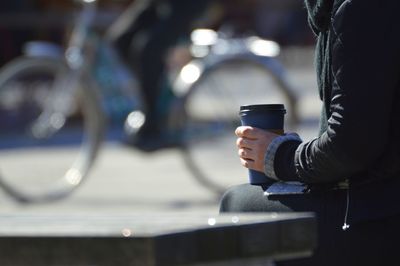 Man holding coffee cup