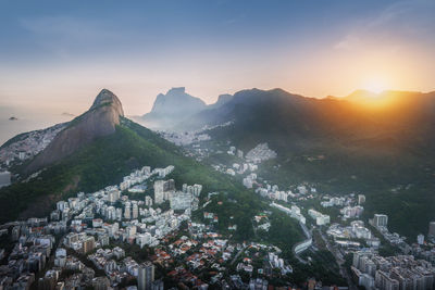 Aerial view of townscape against sky during sunset