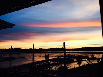 Silhouette bridge against sky during sunset