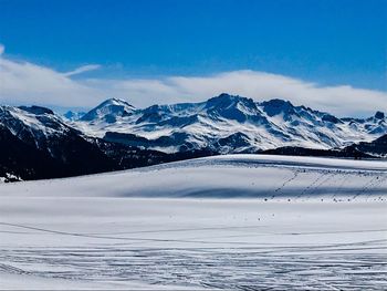 Scenic view of snowcapped mountains against sky