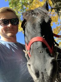 Portrait of mature woman wearing sunglasses