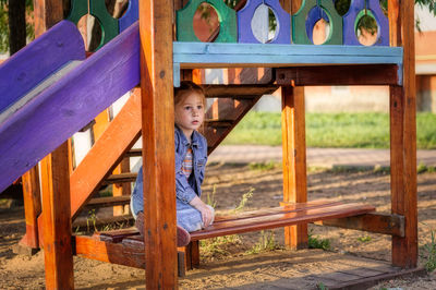 Portrait of boy standing on playground