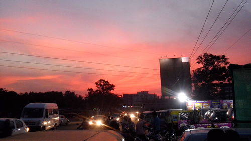 Cars on road at sunset