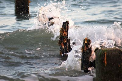 Water splashing on rock in sea