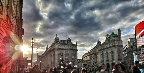 City buildings against cloudy sky