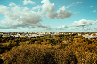 Scenic view of sea and landscape against cloudy sky