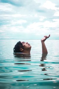 Portrait of man swimming in sea