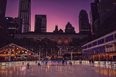 Buildings in city at dusk