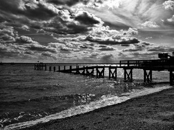 Scenic view of sea against cloudy sky