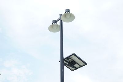 Low angle view of street light against sky