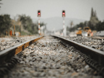 Surface level of railroad tracks against sky