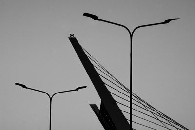 Low angle view of street light against sky