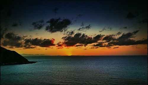 Scenic view of sea at sunset