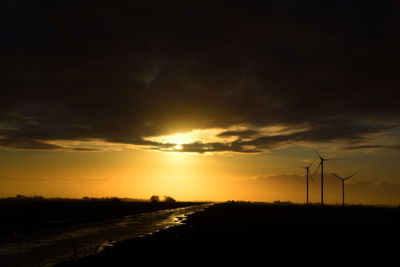 Scenic view of silhouette landscape against sky during sunset