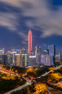 High angle view of illuminated buildings in city against sky