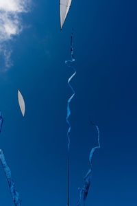 Low angle view of tree against blue sky