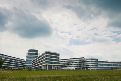 Buildings in city against sky