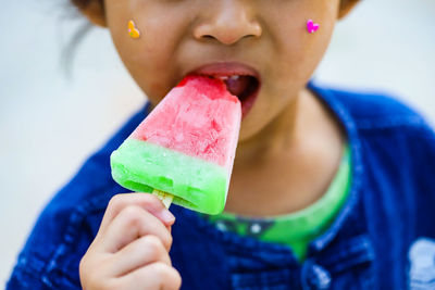 Midsection of woman eating ice cream