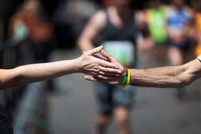 Midsection of man holding hands