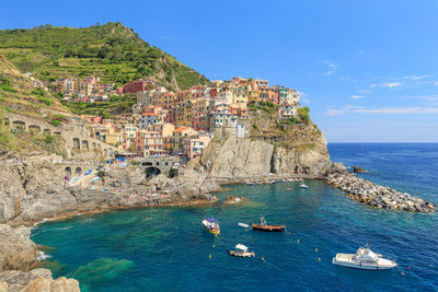 Panoramic view of sea and buildings against sky