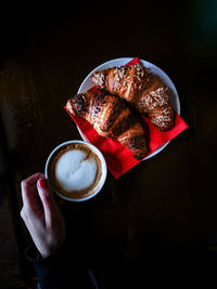 Person holding coffee cup