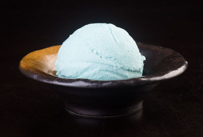 Close-up of ice cream against black background