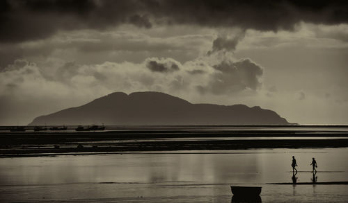 Scenic view of silhouette mountains against sky